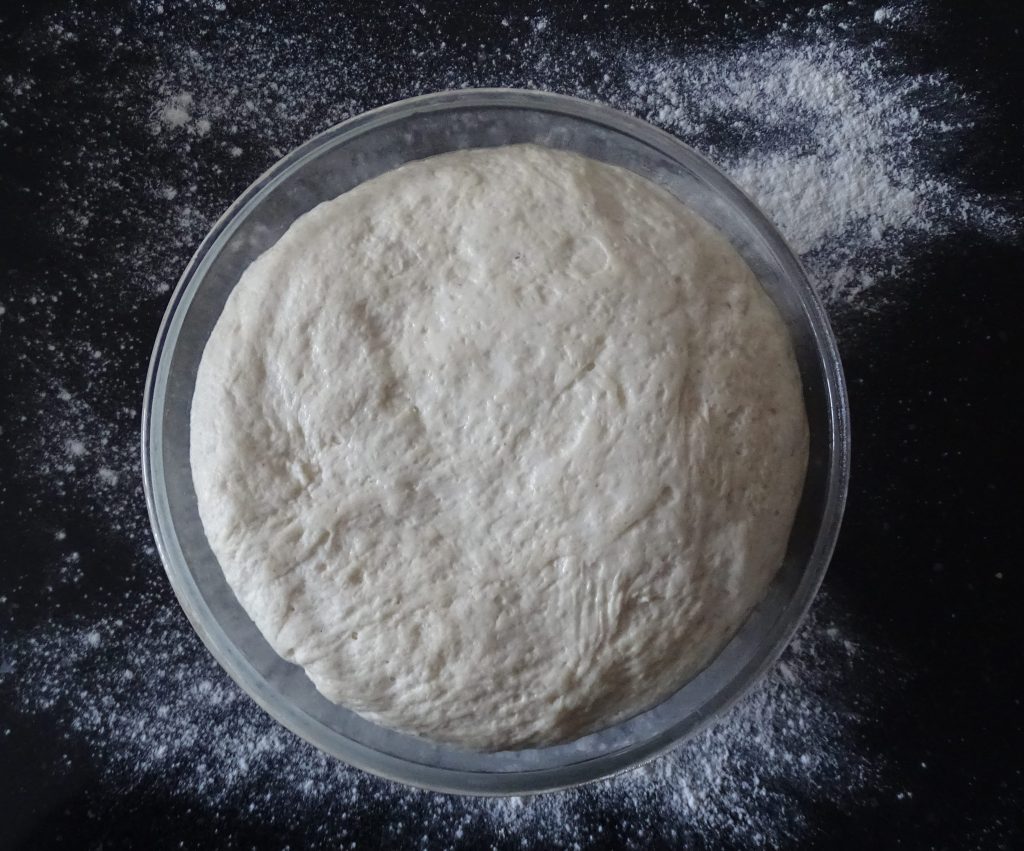 bowl of bread dough, yeast, flour, olive oil
