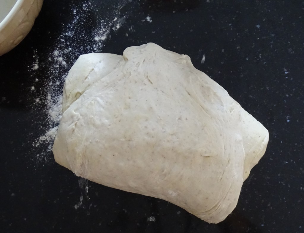 Food Photography folding the sourdough