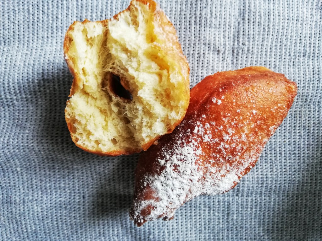 Torn beignet, tea towel