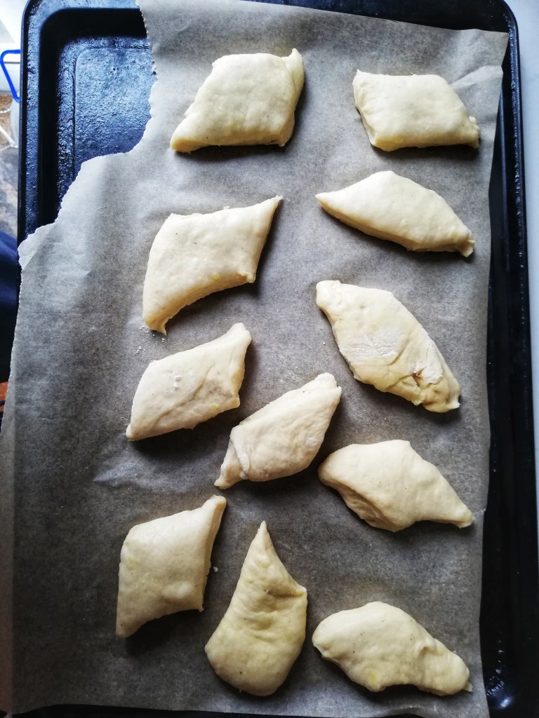 Beignet dough shaped into diamonds, tray