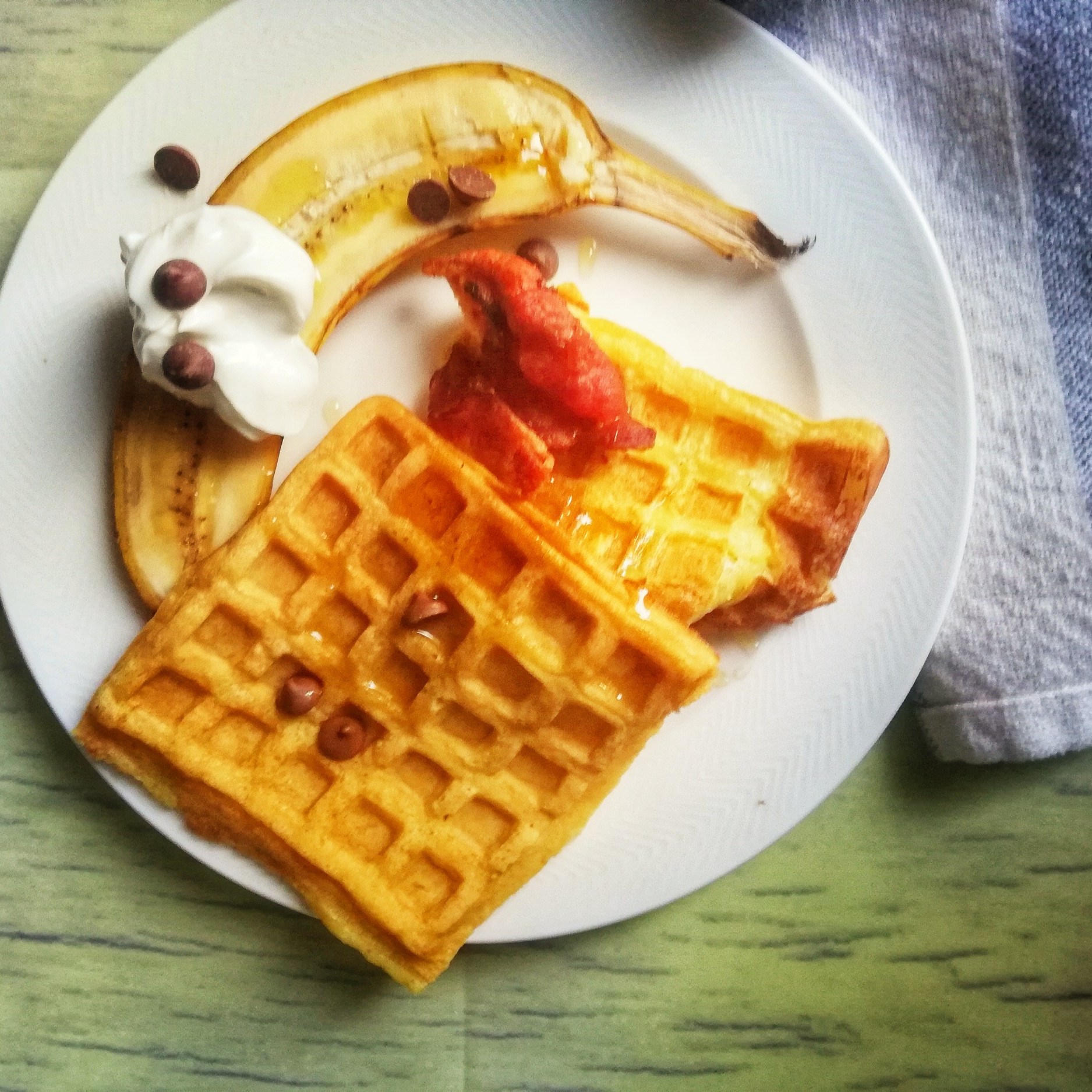 Waffles, crispy bacon, bacon, greek yogurt, chocolate drops