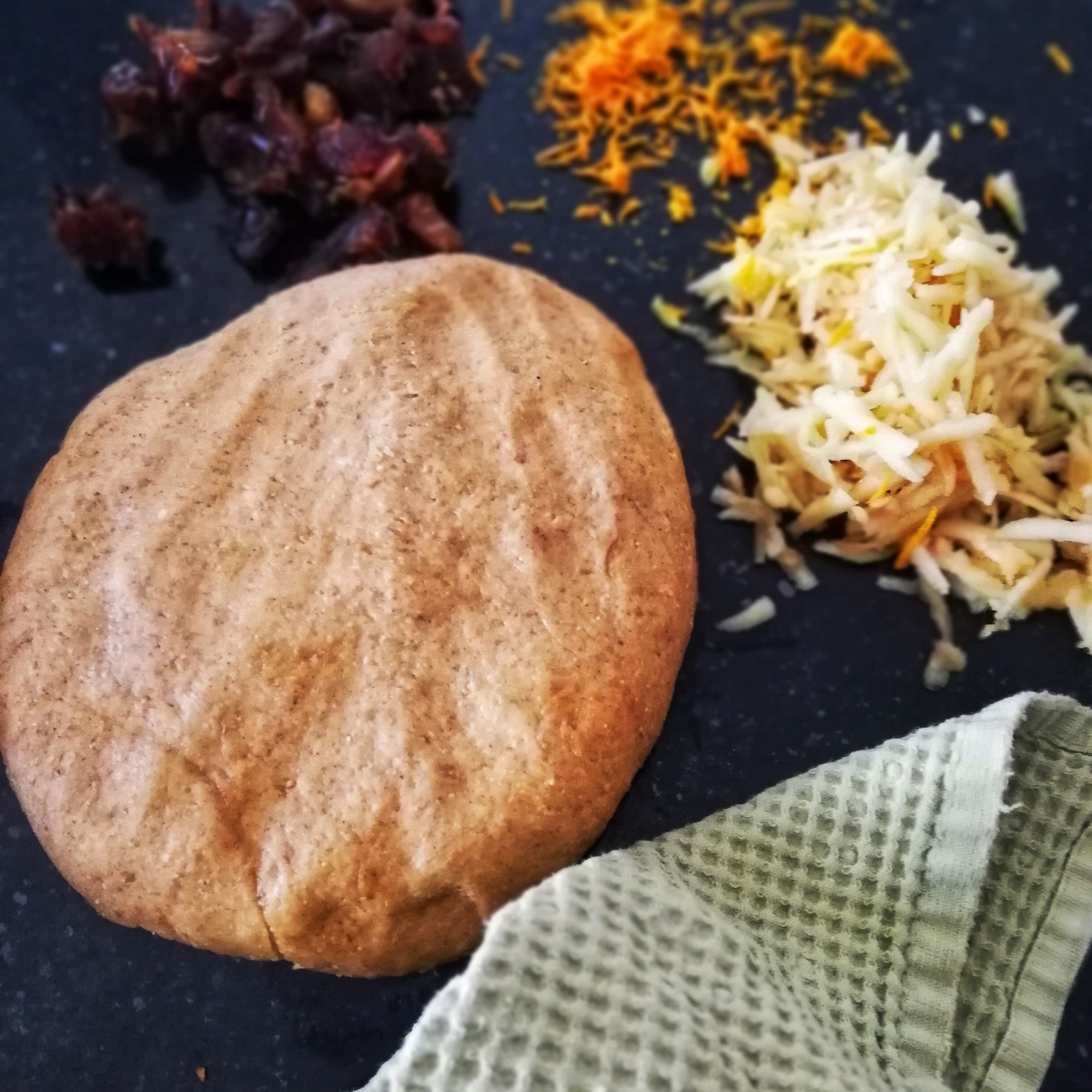 Food photography,Hot cross bun dough, shredded apple, chopped dates, orange zest