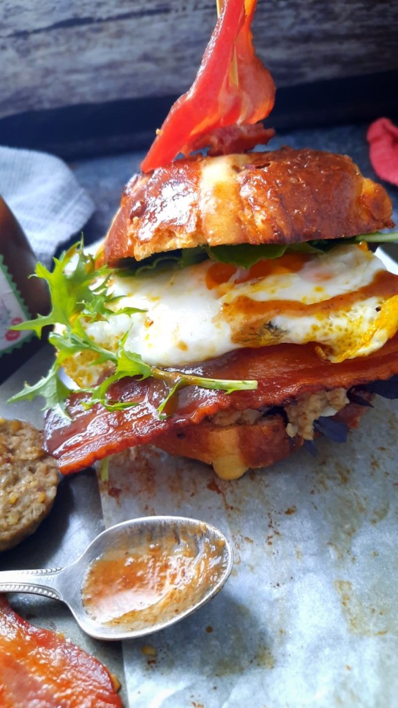 Hot cross bun brunch roll, Free range egg, smoked bacon, white pudding,plum ketchup