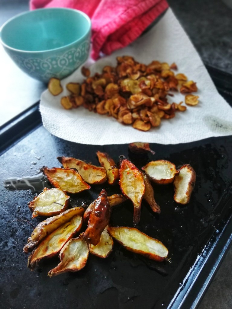 Food photography,Jerusalem artichoke crisps and roasted wedges, baking tray
