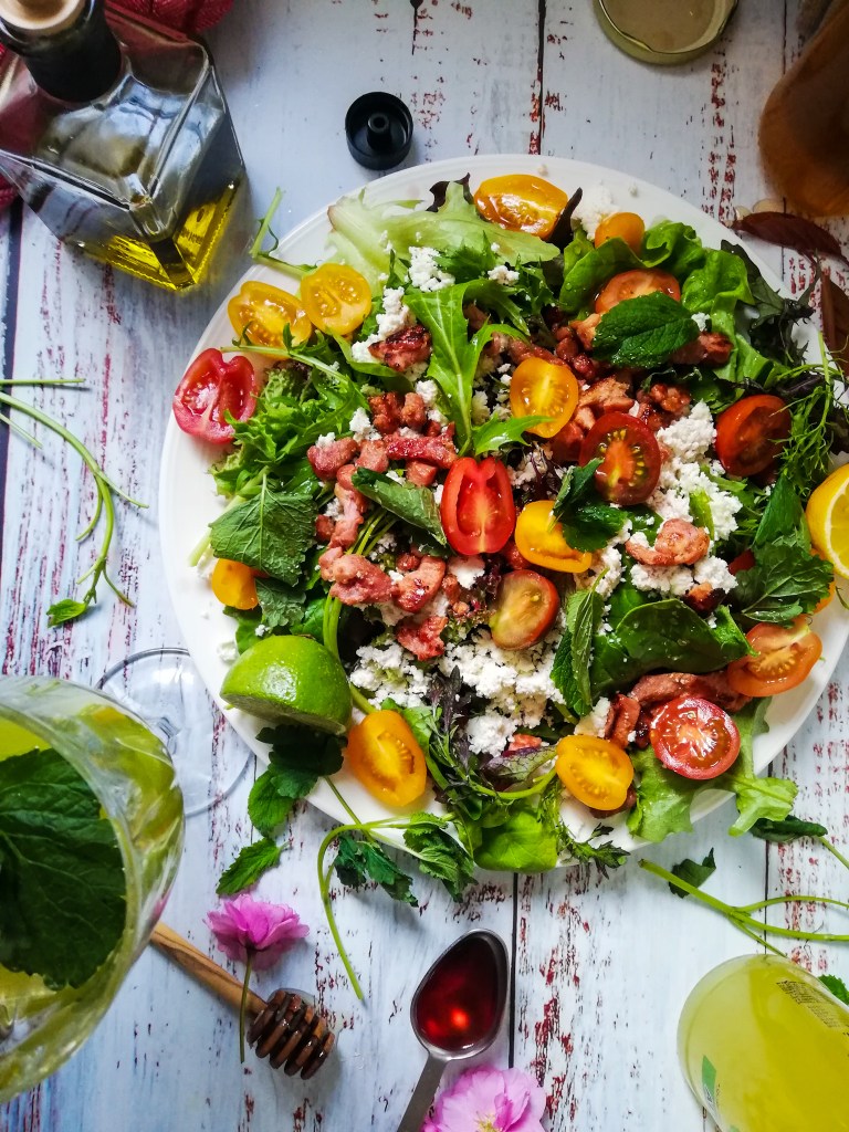 Food photography,Seasonal leaves, sheep's milk ricotta, Smoky bacon lardons, rainbow tomatoes,oil, vinegar