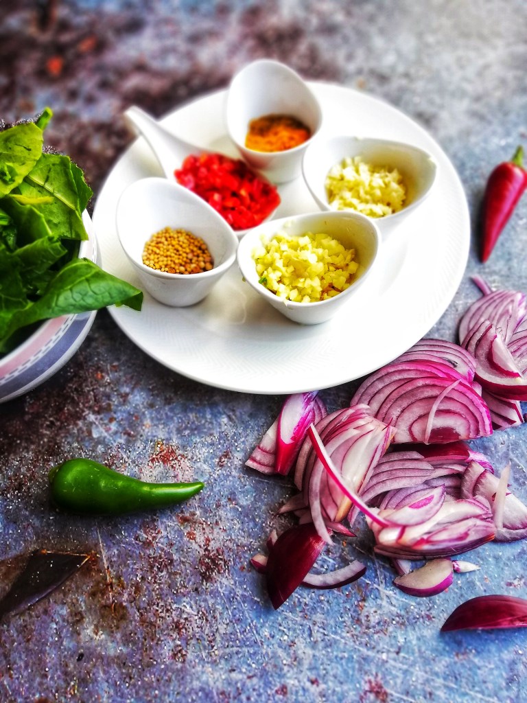 Food photography,Spices, Chopped ginger, garlic, chilli, red onions, greens