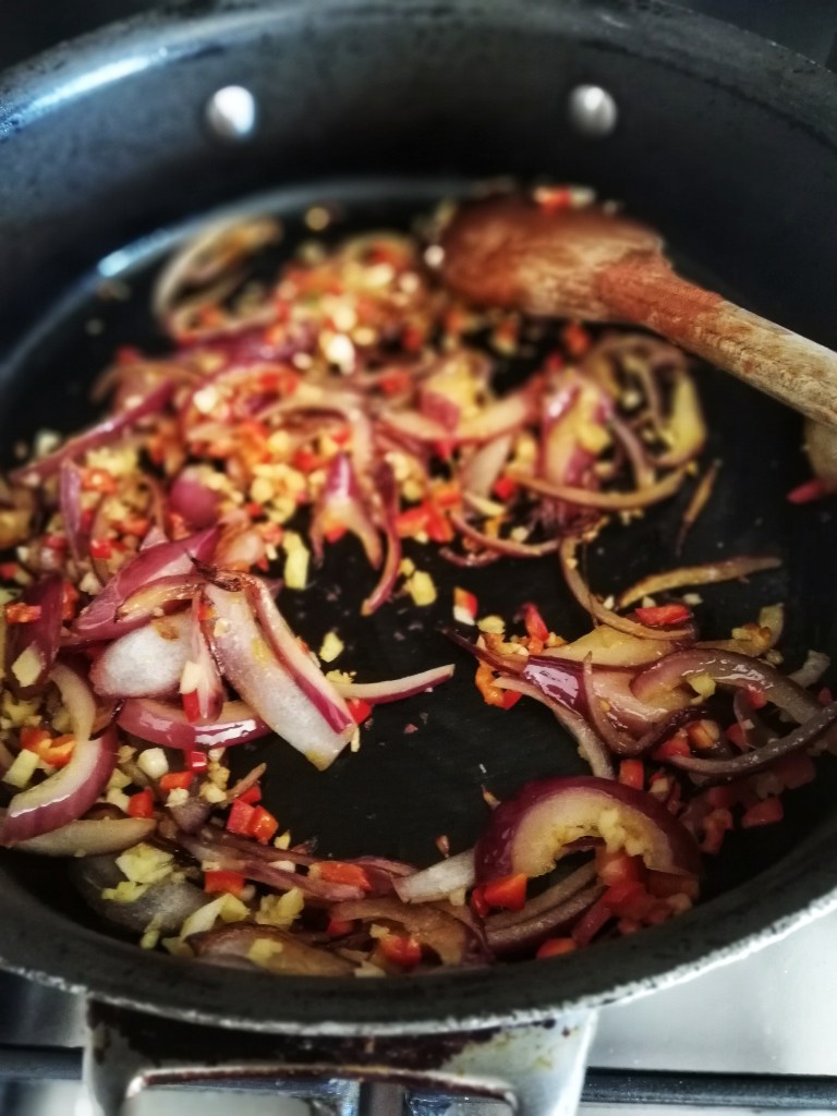 Sauteing onions, ginger, garlic and spices