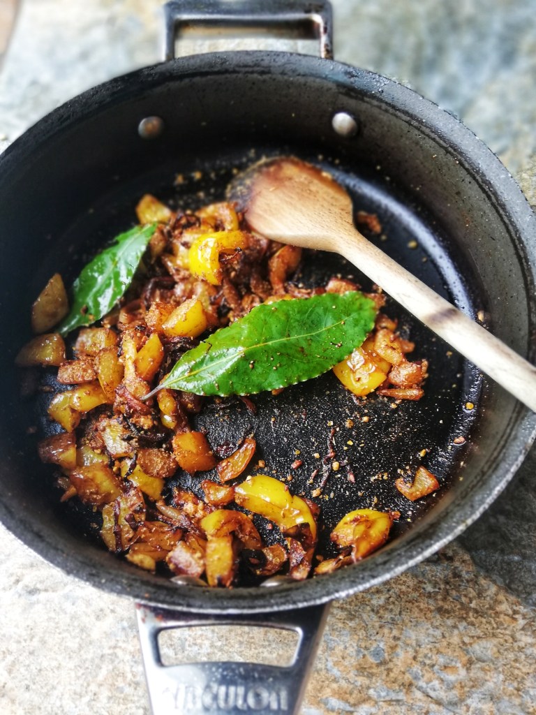 Food photography,Blending the spices & bay leaf with peppers and shallots