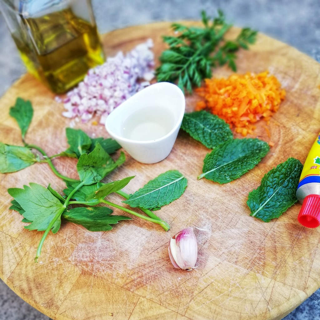 Ingredients for dressing on chopping block.