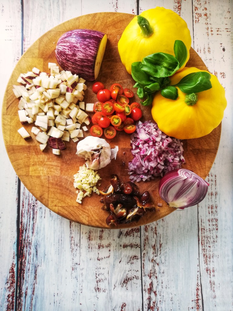 Image, ingredients for stuffed Pattypan squash on chopping block