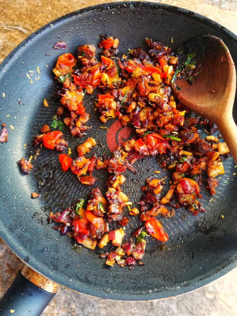 Image, Pan frying the stuffing mix for pattypan squash, wooden spoon.