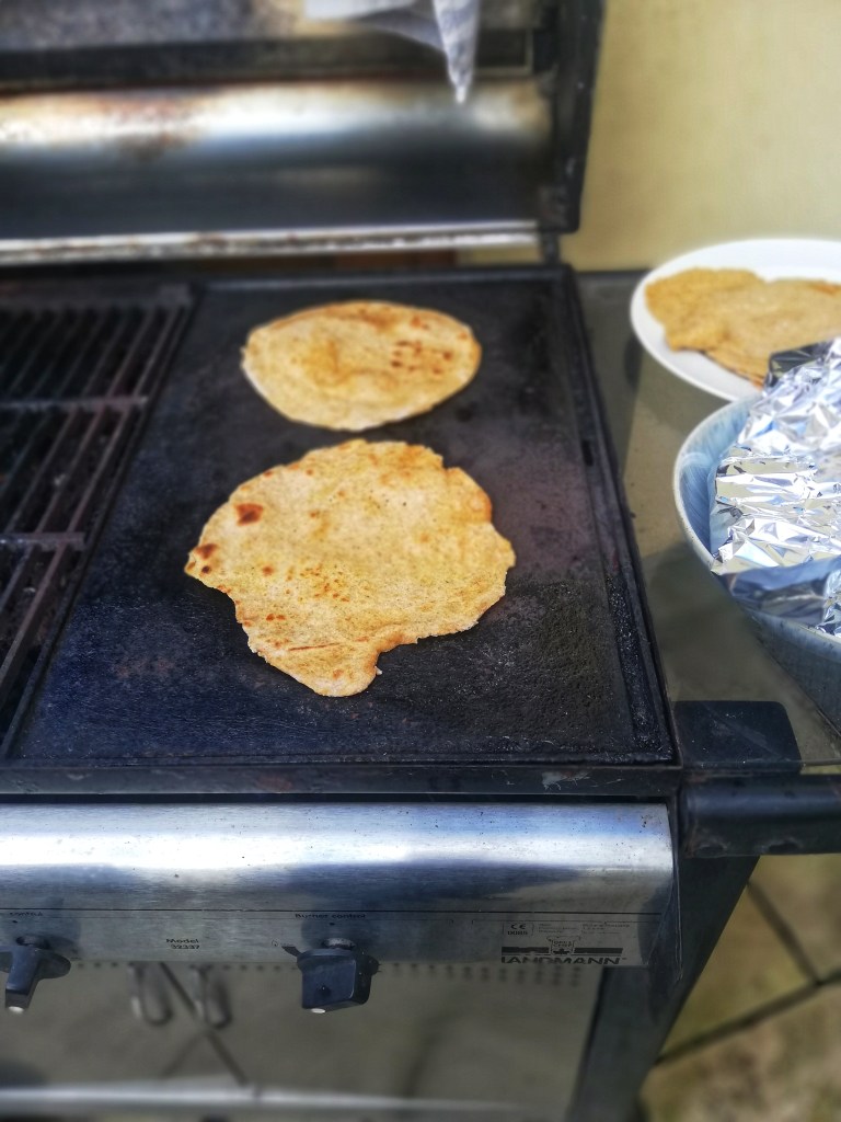 Image, cooking the flatbread on bbq griddle
