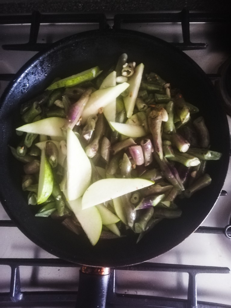 Image, sauteing the purple green beans and sliced Pear