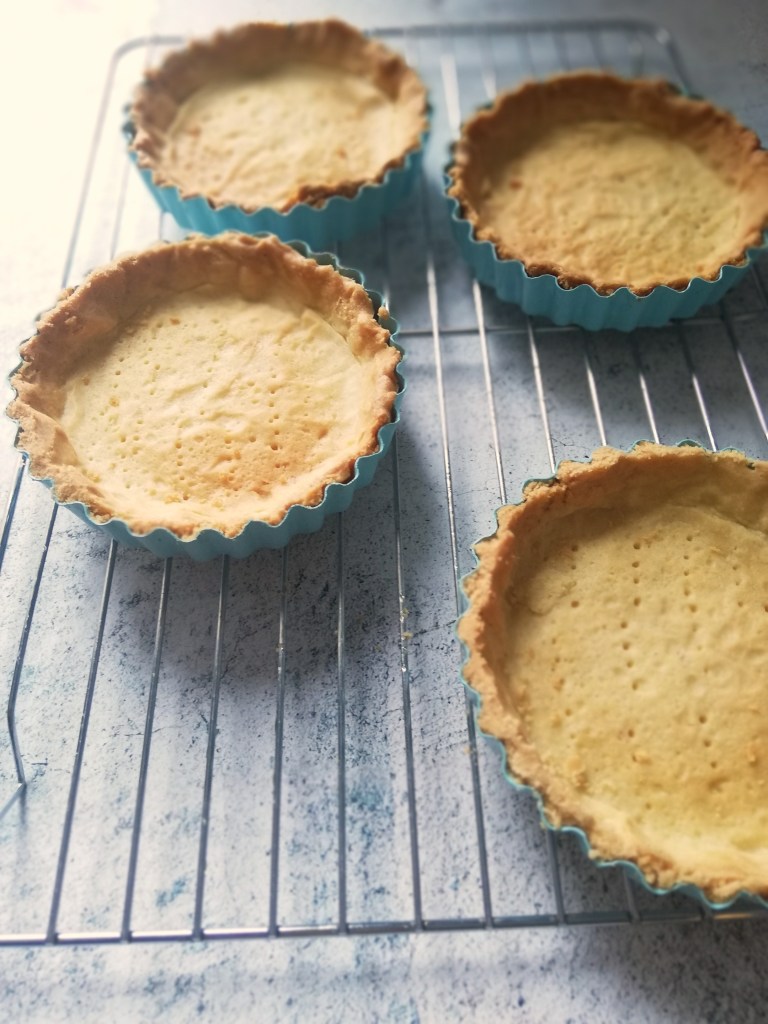 Image, on wire rack, cooling, baked tart shells