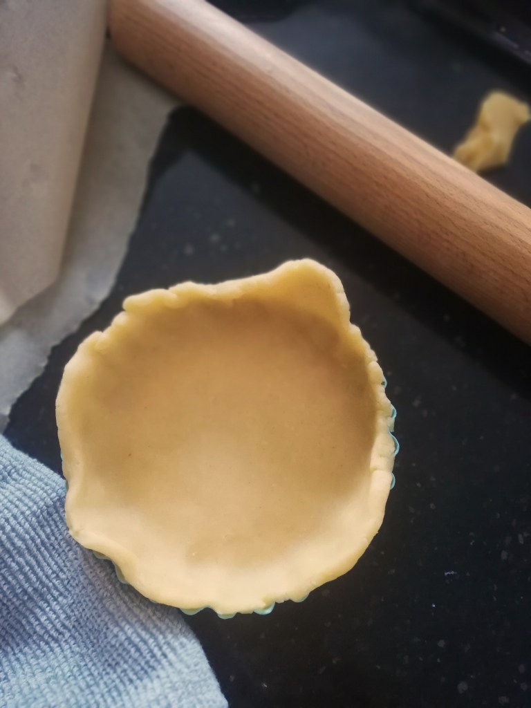 Image, Fluted pastry case lined with pastry, rolling pin.