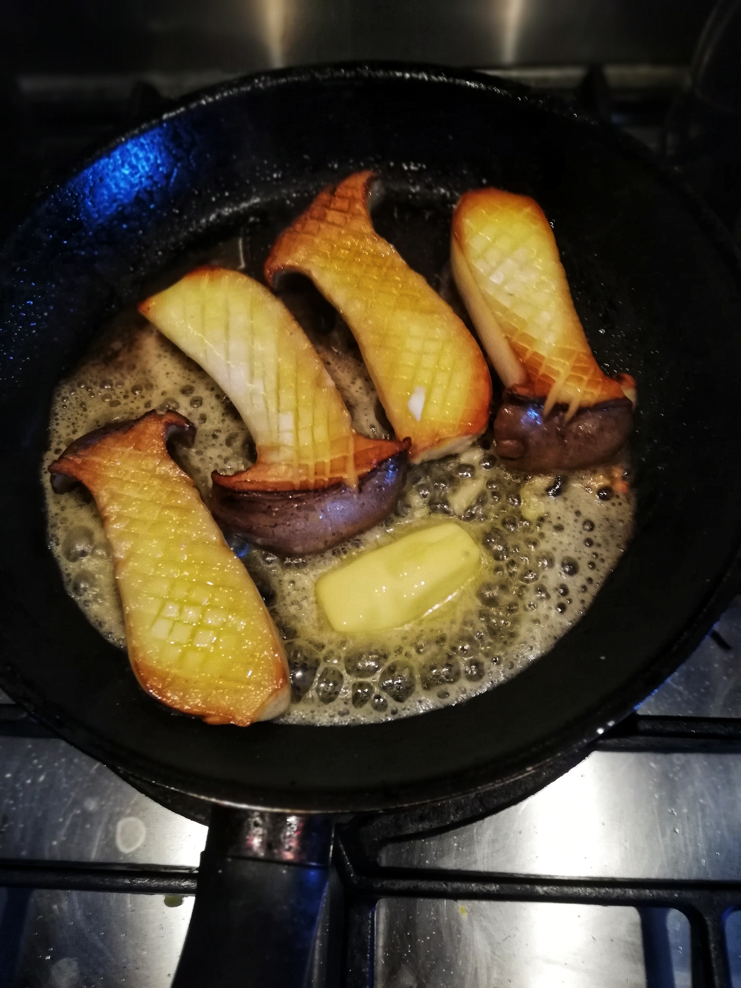 Image, Sauteing king oyster mushroom in frying pan, sizzling butter.