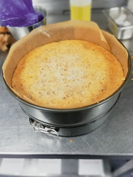 Layering the sponge inside the tin will help to create that even shape-finish with a top layer of cream and strawberry glaze